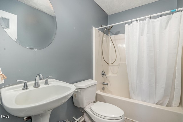 8404 Frenchorn Ln, Fayetteville, NC 28314 - full bath with a sink, a textured ceiling, toilet, and shower / bath combination with curtain