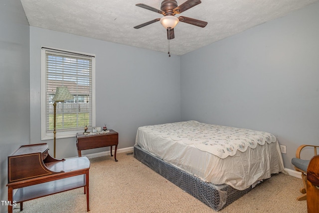 8404 Frenchorn Ln, Fayetteville, NC 28314 - bedroom featuring a textured ceiling, baseboards, and carpet floors