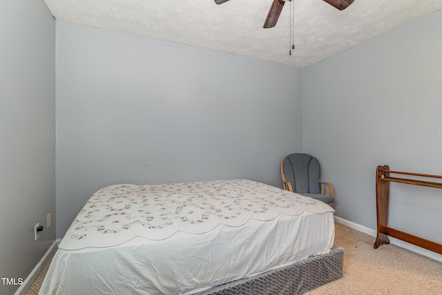 8404 Frenchorn Ln, Fayetteville, NC 28314 - bedroom featuring a textured ceiling, a ceiling fan, baseboards, and carpet floors