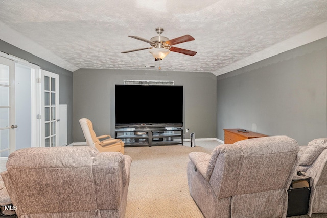 8404 Frenchorn Ln, Fayetteville, NC 28314 - carpeted living room with baseboards, a textured ceiling, ceiling fan, and vaulted ceiling
