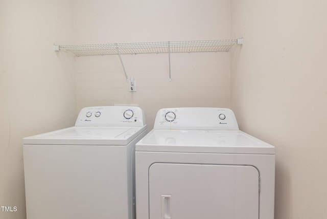 8404 Frenchorn Ln, Fayetteville, NC 28314 - washroom featuring washing machine and clothes dryer and laundry area