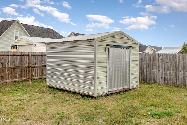 8404 Frenchorn Ln, Fayetteville, NC 28314 - view of shed with a fenced backyard