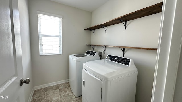 49 W Copenhaver Dr, Clayton, NC 27527 - clothes washing area featuring washer and dryer, healthy amount of natural light, and baseboards