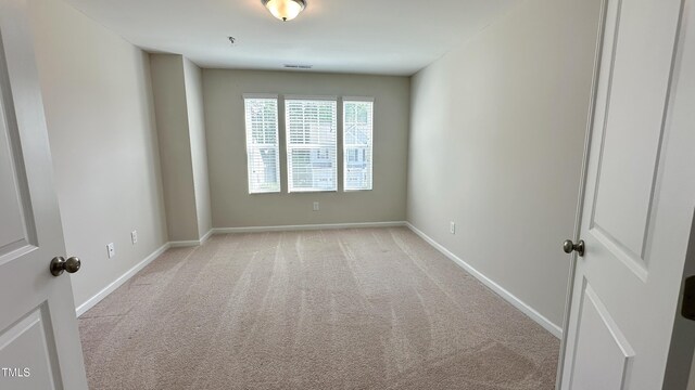 49 W Copenhaver Dr, Clayton, NC 27527 - unfurnished room featuring light colored carpet and baseboards