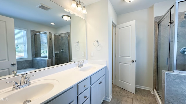 49 W Copenhaver Dr, Clayton, NC 27527 - bathroom with a stall shower, double vanity, and tile patterned flooring