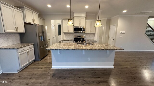 49 W Copenhaver Dr, Clayton, NC 27527 - kitchen featuring appliances with stainless steel finishes, a sink, ornamental molding, decorative backsplash, and a breakfast bar area
