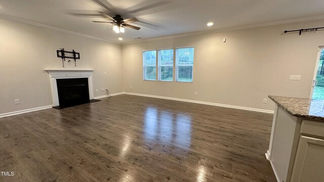 49 W Copenhaver Dr, Clayton, NC 27527 - unfurnished living room featuring a ceiling fan, ornamental molding, dark wood finished floors, recessed lighting, and a fireplace