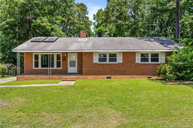 3518 Drayton Rd, Fayetteville, NC 28303 - ranch-style home featuring a front lawn, roof mounted solar panels, crawl space, brick siding, and a chimney