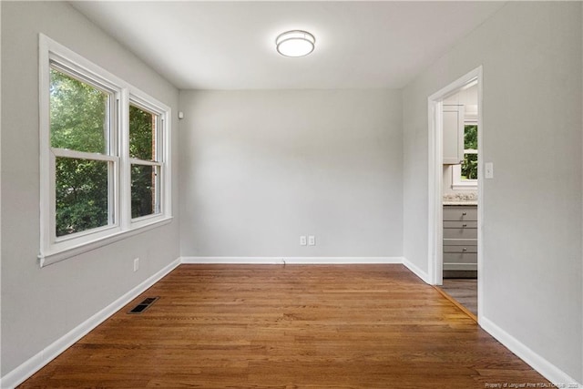 3518 Drayton Rd, Fayetteville, NC 28303 - unfurnished room featuring visible vents, baseboards, and wood finished floors