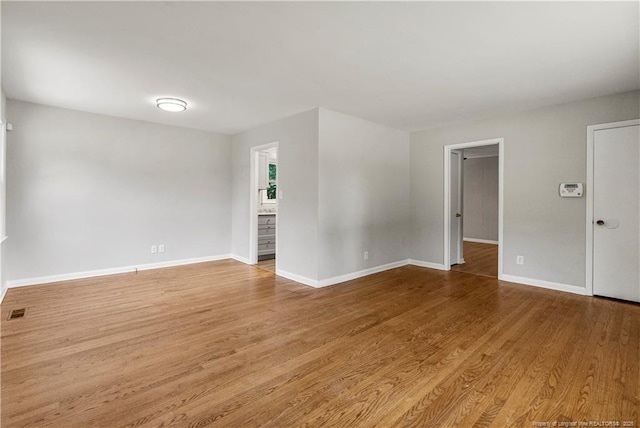 3518 Drayton Rd, Fayetteville, NC 28303 - unfurnished room featuring visible vents, baseboards, and wood finished floors
