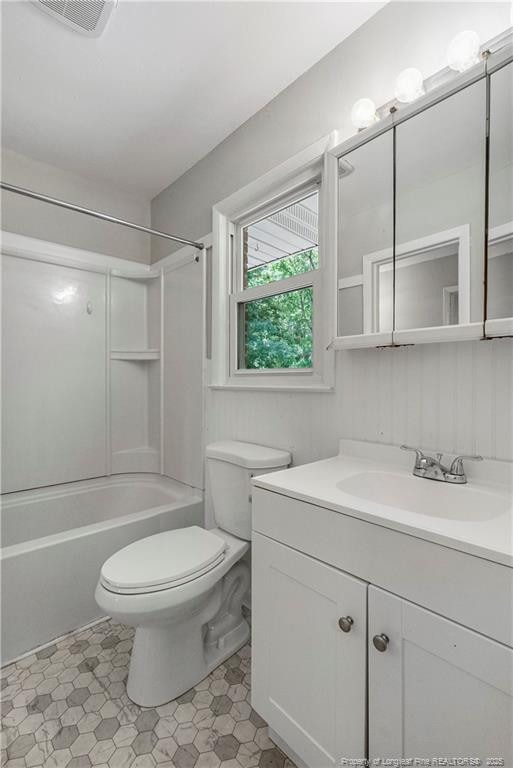 3518 Drayton Rd, Fayetteville, NC 28303 - bathroom with visible vents, shower / bathtub combination, toilet, and vanity