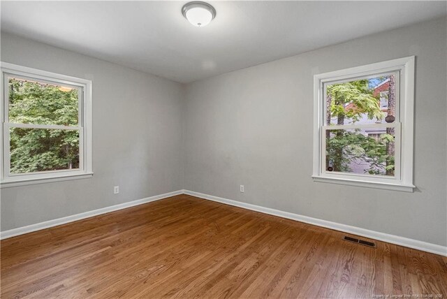 3518 Drayton Rd, Fayetteville, NC 28303 - spare room with light wood finished floors, visible vents, and baseboards