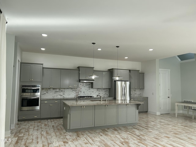 6609 Truxton Ln, Raleigh, NC 27616 - kitchen with stainless steel appliances, gray cabinets, a sink, a kitchen island with sink, and recessed lighting