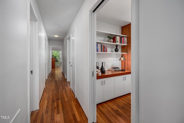hall with dark wood-style floors
