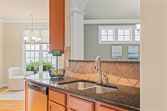 5233 Greymoss Ln, Apex, NC 27539 - kitchen featuring dishwasher, a sink, crown molding, tasteful backsplash, and arched walkways