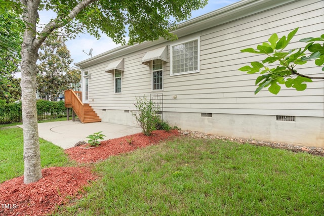 5233 Greymoss Ln, Apex, NC 27539 - view of side of home featuring crawl space, a yard, and a patio