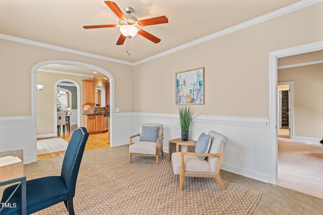 5233 Greymoss Ln, Apex, NC 27539 - home office with arched walkways, a wainscoted wall, a ceiling fan, and crown molding