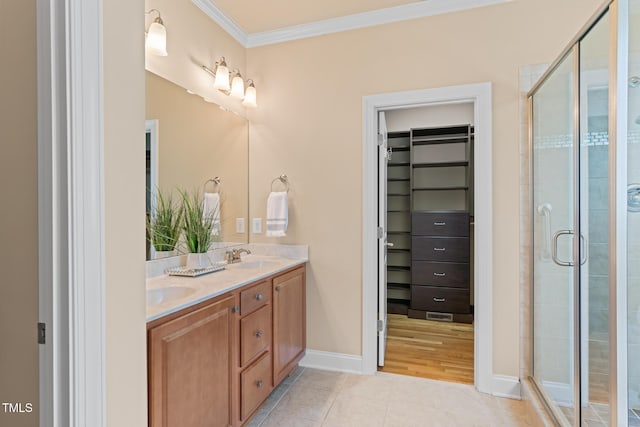 5233 Greymoss Ln, Apex, NC 27539 - bathroom featuring a spacious closet, double vanity, crown molding, and a shower stall