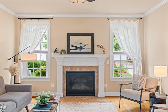 5233 Greymoss Ln, Apex, NC 27539 - living room with ornamental molding, wood finished floors, a fireplace, ceiling fan, and baseboards