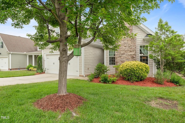 5233 Greymoss Ln, Apex, NC 27539 - view of property hidden behind natural elements featuring concrete driveway, an attached garage, and a front yard