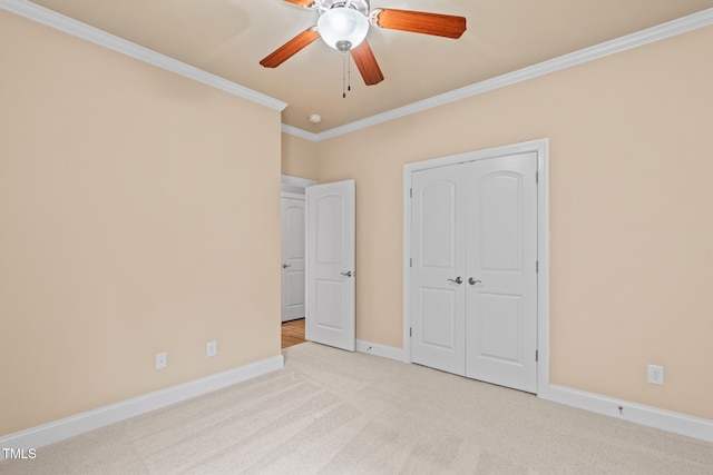 5233 Greymoss Ln, Apex, NC 27539 - unfurnished bedroom featuring crown molding, carpet floors, baseboards, a closet, and a ceiling fan