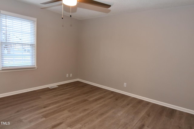 107 Ware Ct, Garner, NC 27529 - empty room with baseboards, visible vents, a ceiling fan, and wood finished floors