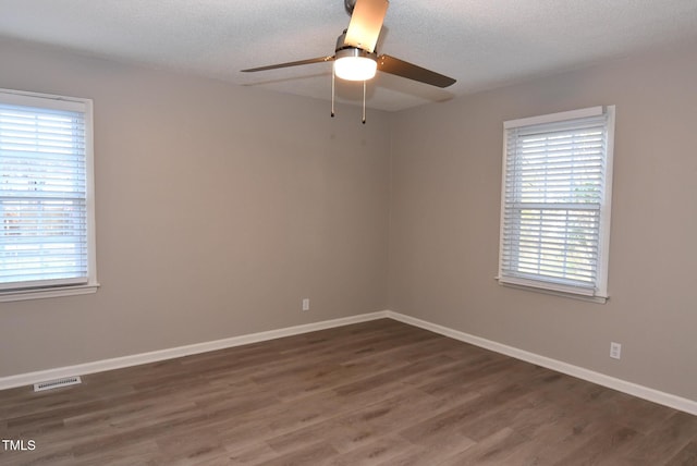 107 Ware Ct, Garner, NC 27529 - spare room featuring baseboards, visible vents, wood finished floors, and a ceiling fan