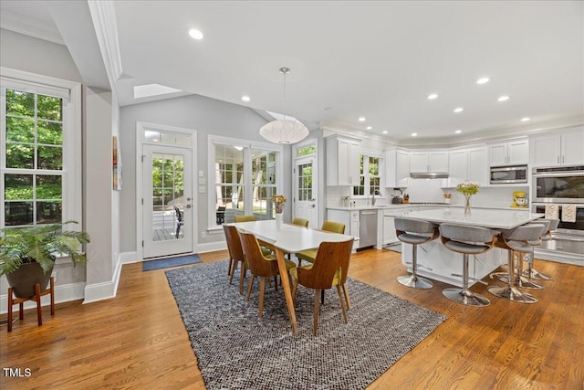1508 Tradescant Ct, Raleigh, NC 27613 - dining space with recessed lighting, light wood-style floors, french doors, and lofted ceiling