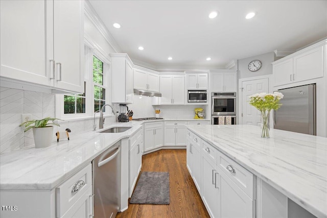 1508 Tradescant Ct, Raleigh, NC 27613 - kitchen with stainless steel appliances, white cabinets, tasteful backsplash, dark wood-style floors, and recessed lighting