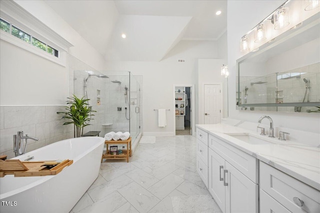 1508 Tradescant Ct, Raleigh, NC 27613 - full bath featuring a shower stall, marble look tile flooring, vanity, a freestanding bath, and vaulted ceiling
