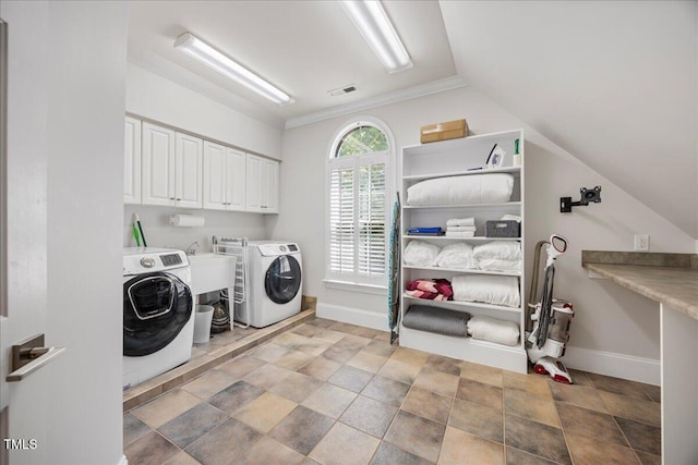 1508 Tradescant Ct, Raleigh, NC 27613 - laundry area featuring cabinet space, washer and dryer, and stone finish floors