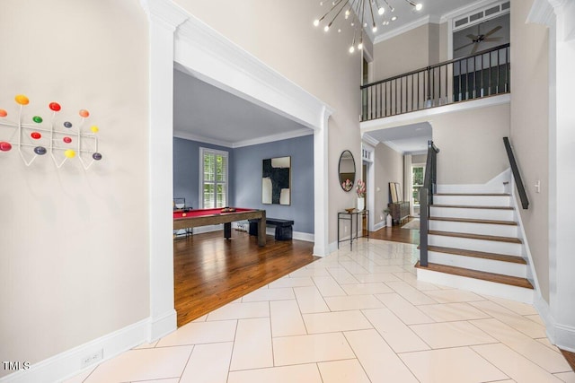 1508 Tradescant Ct, Raleigh, NC 27613 - entrance foyer featuring ornamental molding, pool table, tile patterned flooring, and stairs