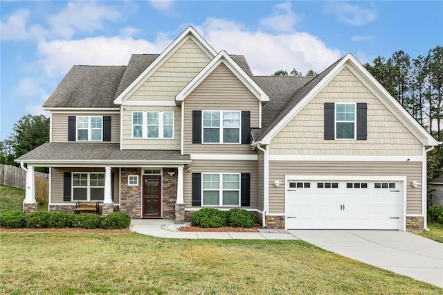 craftsman inspired home featuring a garage, concrete driveway, stone siding, a porch, and roof with shingles