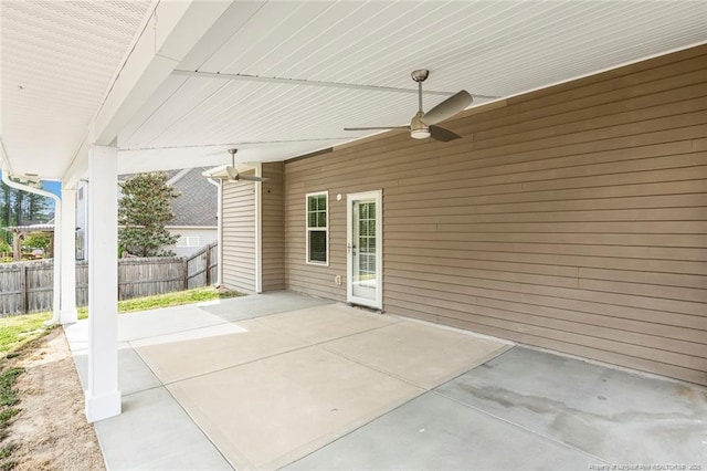 view of patio / terrace featuring fence and a ceiling fan