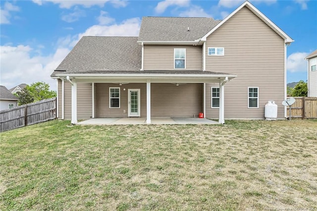 back of property featuring a patio area and a shingled roof