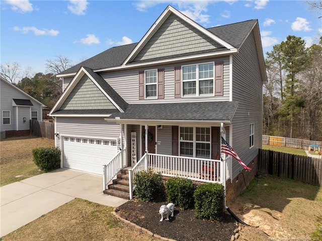 view of front of house with a porch, concrete driveway, fence, and a shingled roof