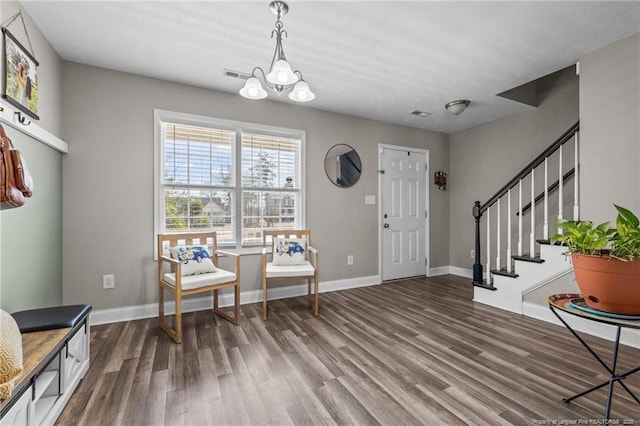 263 Autumn Ln, Raeford, NC 28376 - entryway featuring wood finished floors, a chandelier, stairway, and baseboards