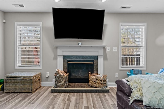 263 Autumn Ln, Raeford, NC 28376 - living area with wood finished floors, healthy amount of natural light, baseboards, and recessed lighting