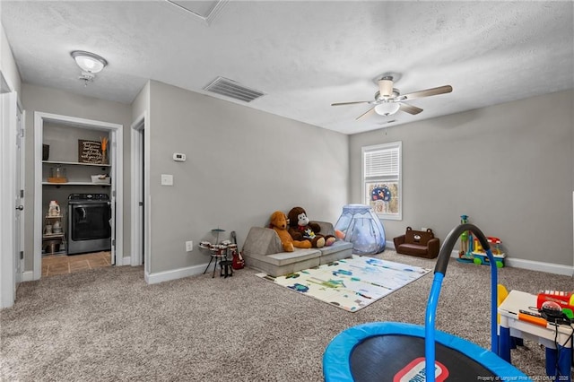 263 Autumn Ln, Raeford, NC 28376 - game room with washer / clothes dryer, carpet, ceiling fan, baseboards, and a textured ceiling