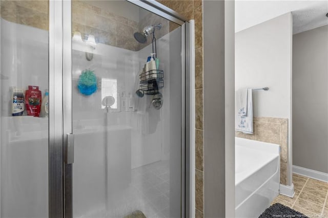 263 Autumn Ln, Raeford, NC 28376 - full bath with a shower stall, a bath, and tile patterned flooring