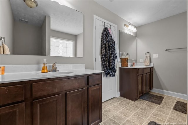 263 Autumn Ln, Raeford, NC 28376 - full bath with two vanities and baseboards