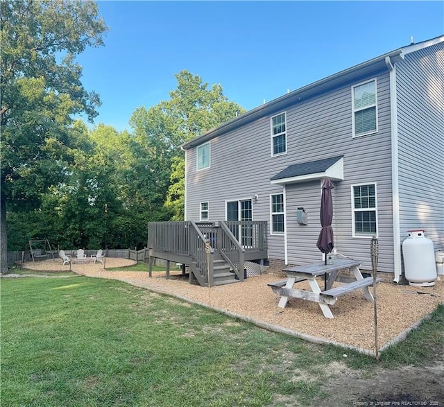 263 Autumn Ln, Raeford, NC 28376 - back of house with a yard and a wooden deck