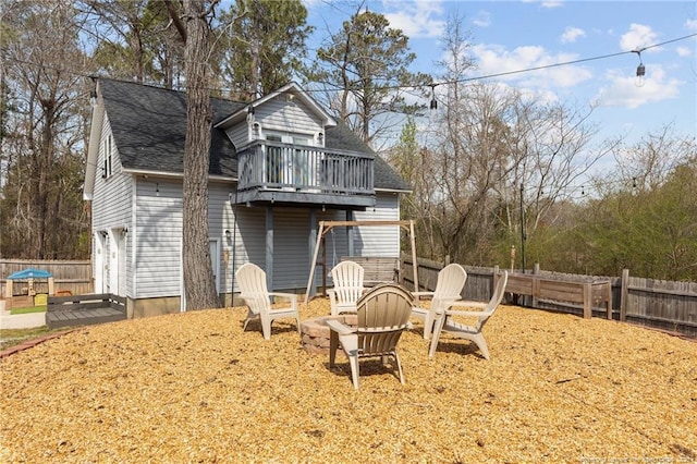 263 Autumn Ln, Raeford, NC 28376 - rear view of house featuring roof with shingles and a wooden deck