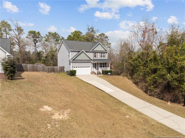 263 Autumn Ln, Raeford, NC 28376 - traditional-style home featuring driveway, a porch, and an attached garage