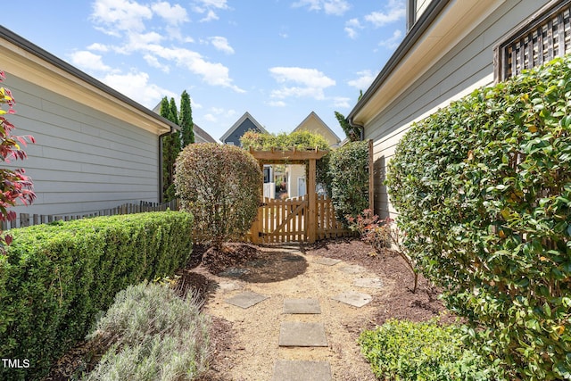 view of yard featuring fence and a gate