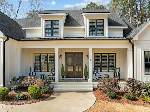 76 Gentry Dr, Pittsboro, NC 27312 - view of exterior entry with french doors, a porch, board and batten siding, and roof with shingles