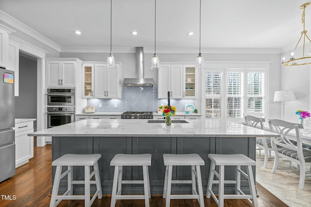 76 Gentry Dr, Pittsboro, NC 27312 - kitchen featuring backsplash, dark wood-style flooring, stainless steel appliances, and wall chimney exhaust hood