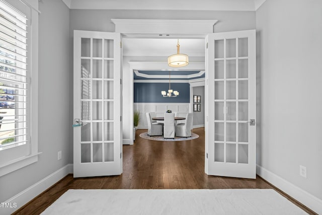 76 Gentry Dr, Pittsboro, NC 27312 - interior space featuring baseboards, a notable chandelier, and wood finished floors