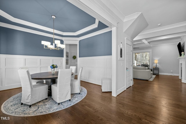 76 Gentry Dr, Pittsboro, NC 27312 - dining room featuring dark wood-style flooring, an inviting chandelier, crown molding, and wainscoting