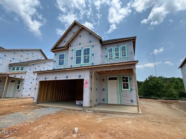 243 Meadowbark Bnd Unit 28, Garner, NC 27529 - unfinished property featuring an attached garage and driveway